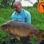 The Hook Bait Company consultant Justin McCann with a specimen mirror carp