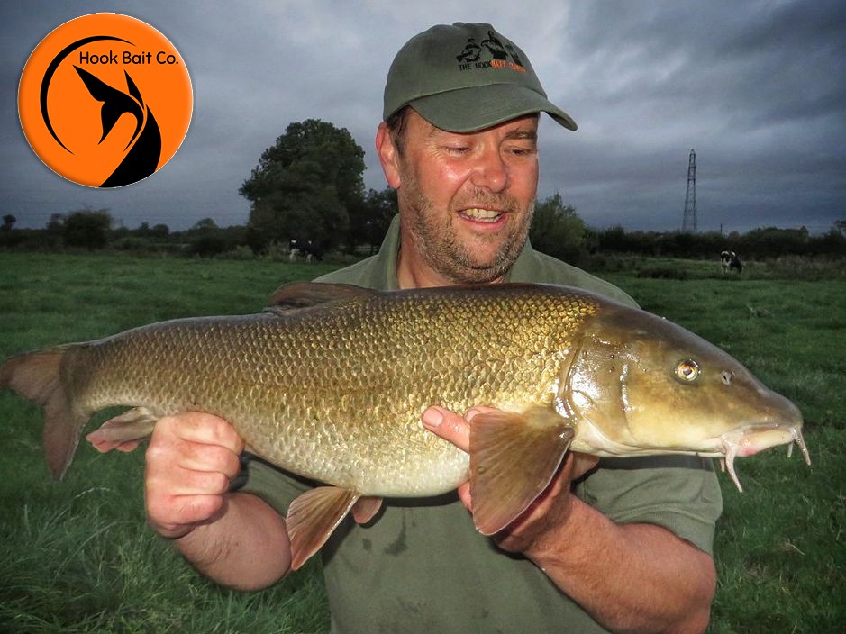 Grazy Roberts with a 12lb 8oz barbel caught on Spicy Fish Pro boilies from the Hook Bait Company 