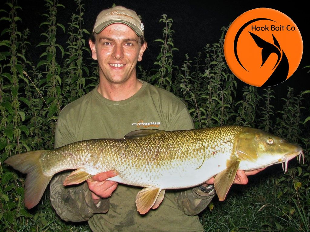 Andrew Kennedy with a 13lb+ specimen barbel caught on the Hook Bait Company baits